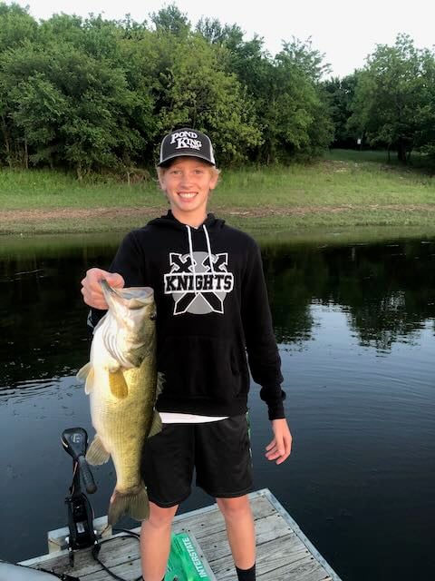 Catching Bass on Pond Boat