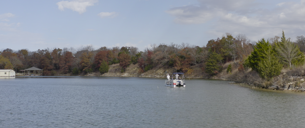 Fishing along shore from a pontoon boat