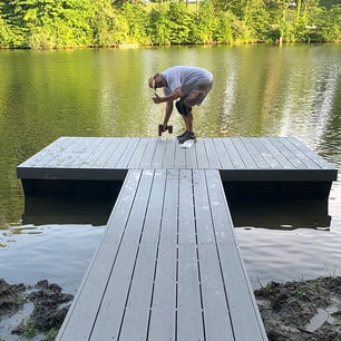Man installing DIY floating dock kit