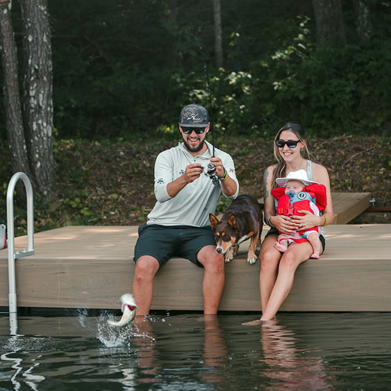 family fishing on dock