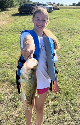 girl holding crappie