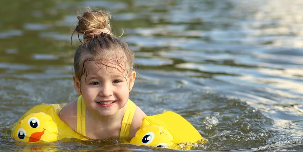 little-girl-swimming-in-pond